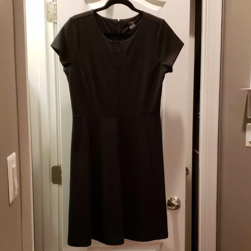 Little black dress with lace detail at neckline